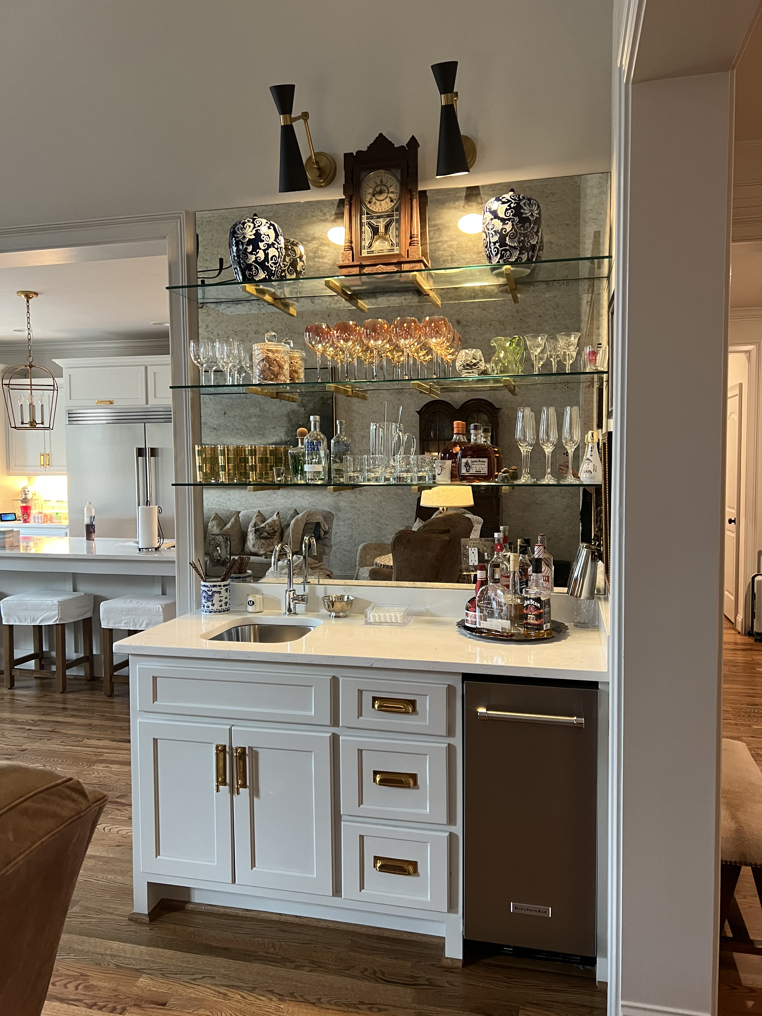 Built-in home bar with glass shelving