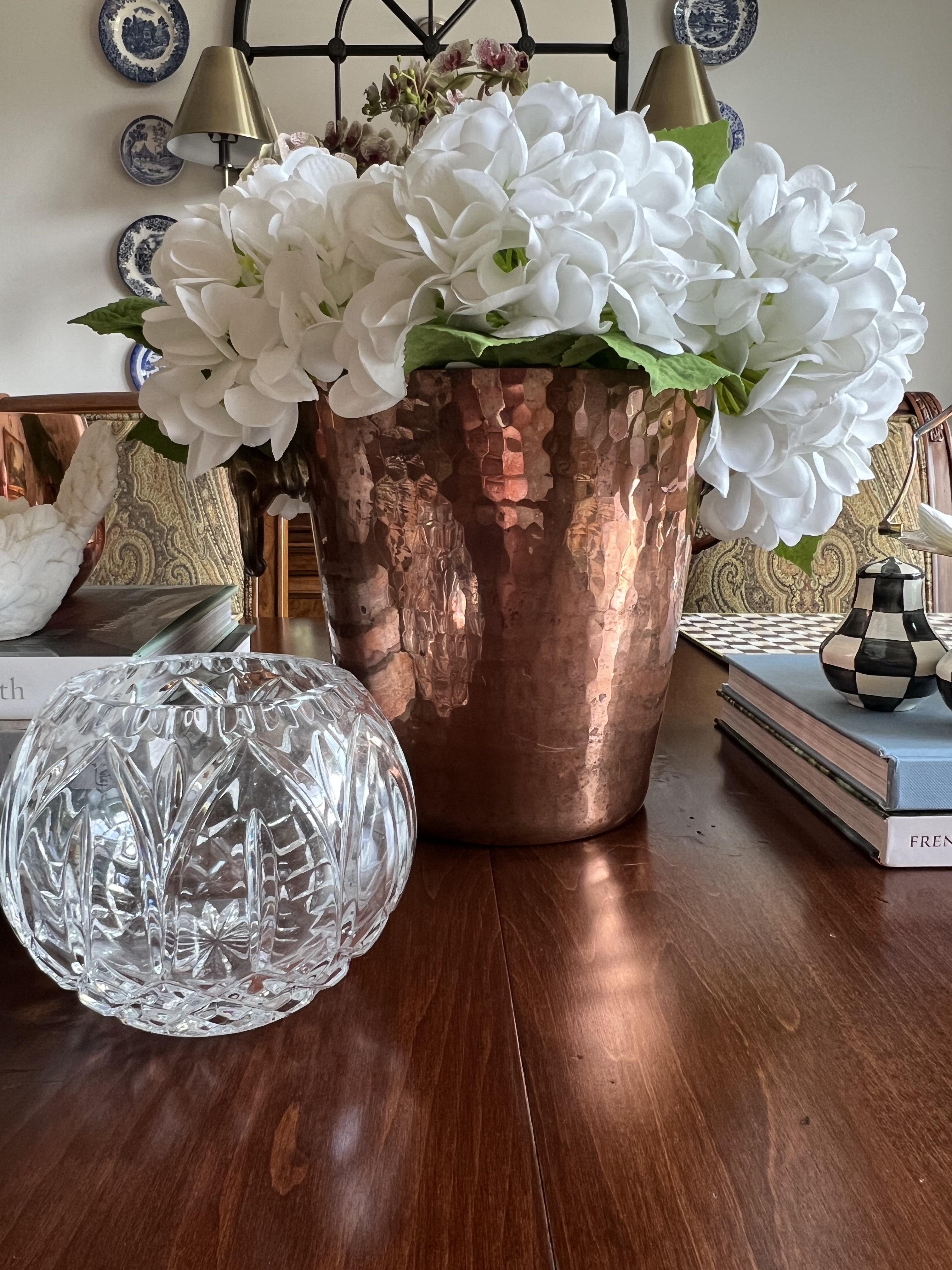 Copper vessel with white hydrangeas