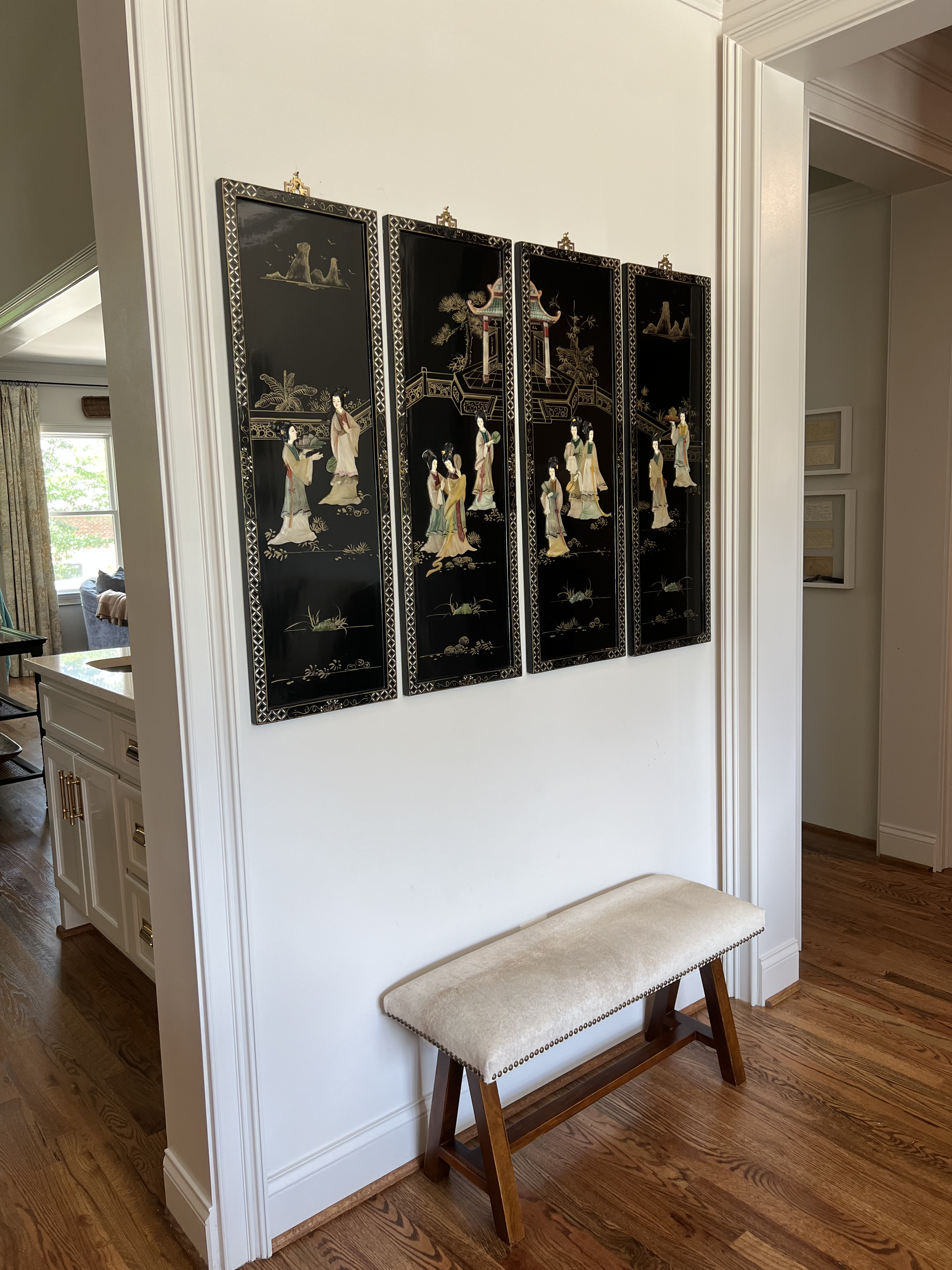 Traditional hallway with framed art